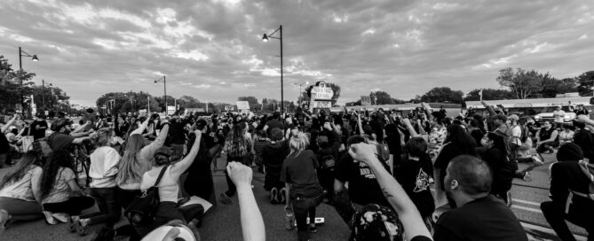 grayscale photo of people on field